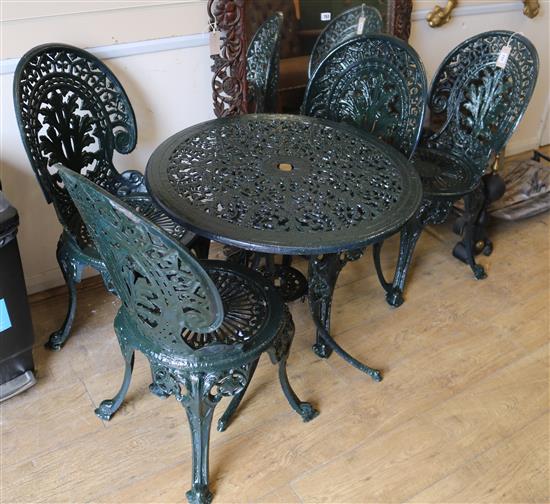 A garden table and four chairs W.69cm